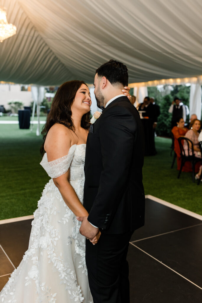 Bride and groom slow dance during wedding reception at The Highlawn Wedding venue in New Jersey. Photographed by Charlotte Wedding photographer.