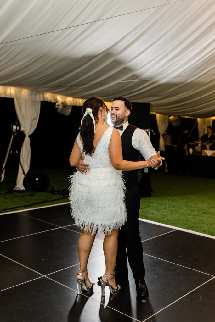 Bride and groom slow dance during wedding reception at The Highlawn Wedding venue in New Jersey. Photographed by Charlotte Wedding photographer.
